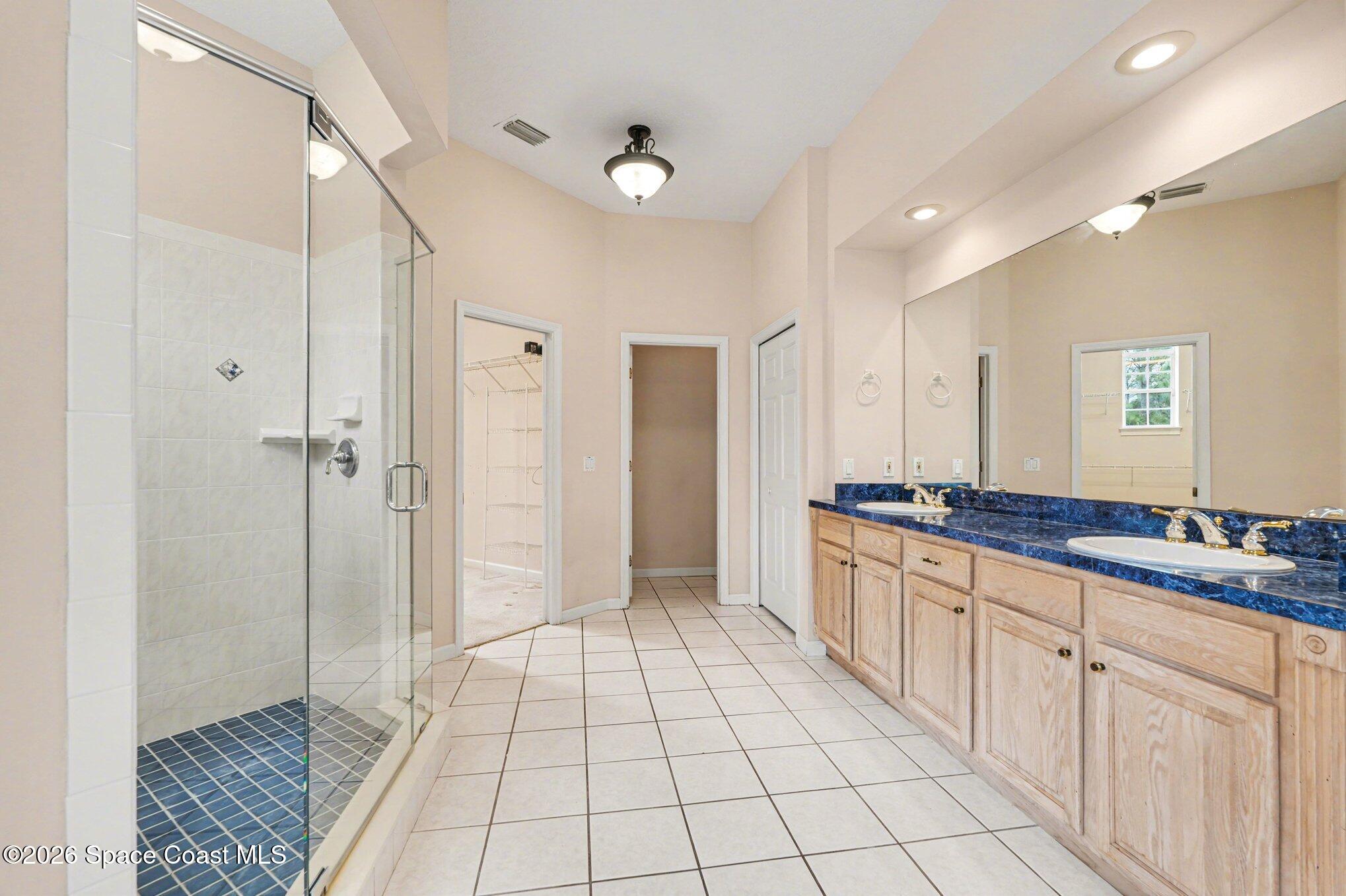 1399 Snapping Turtle Road Mims, FL 32754 - Photo 23 of 51 a large bathroom with a sink a mirror and a shower