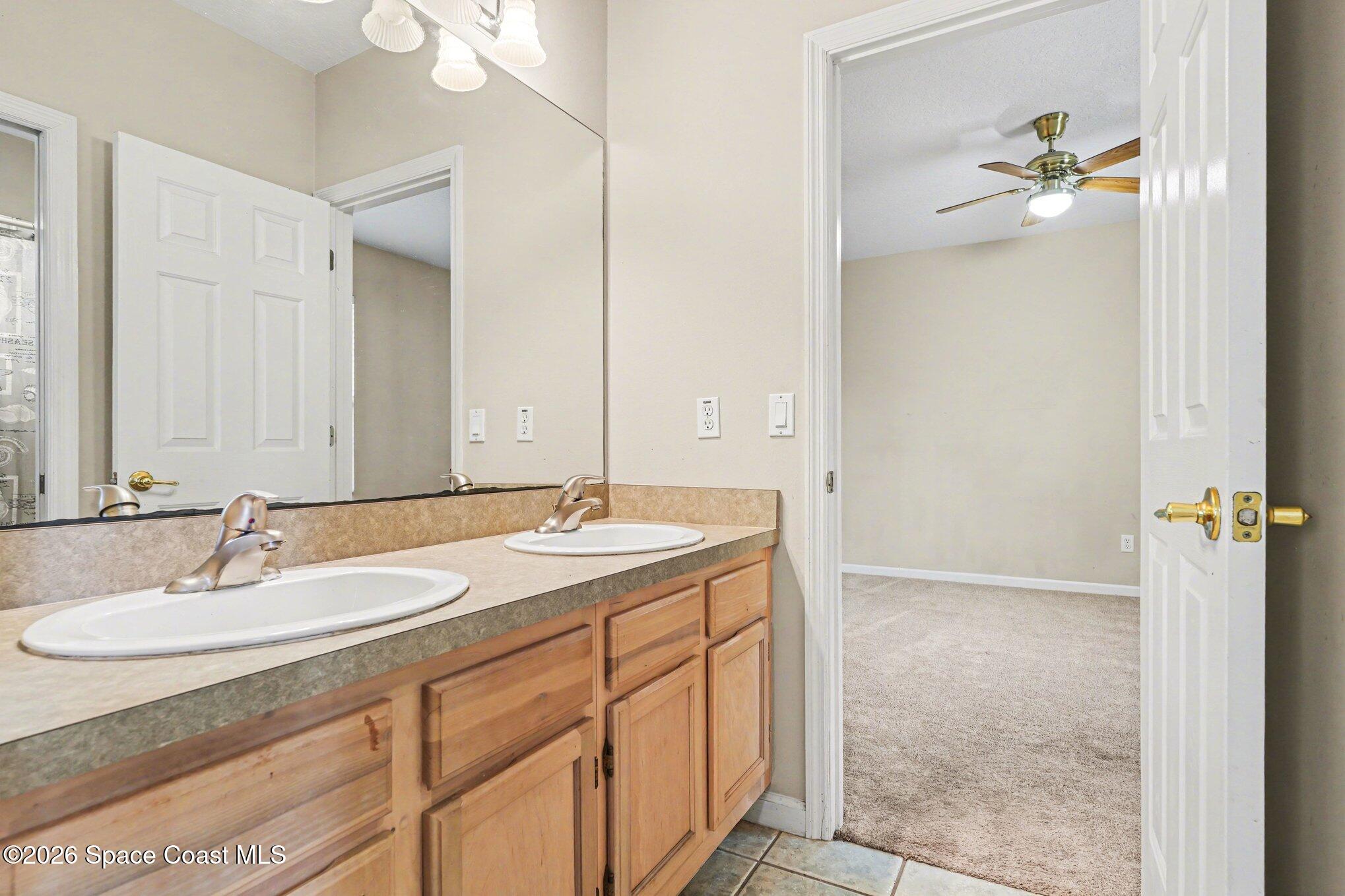 1399 Snapping Turtle Road Mims, FL 32754 - Photo 36 of 51 a bathroom with a sink and mirror