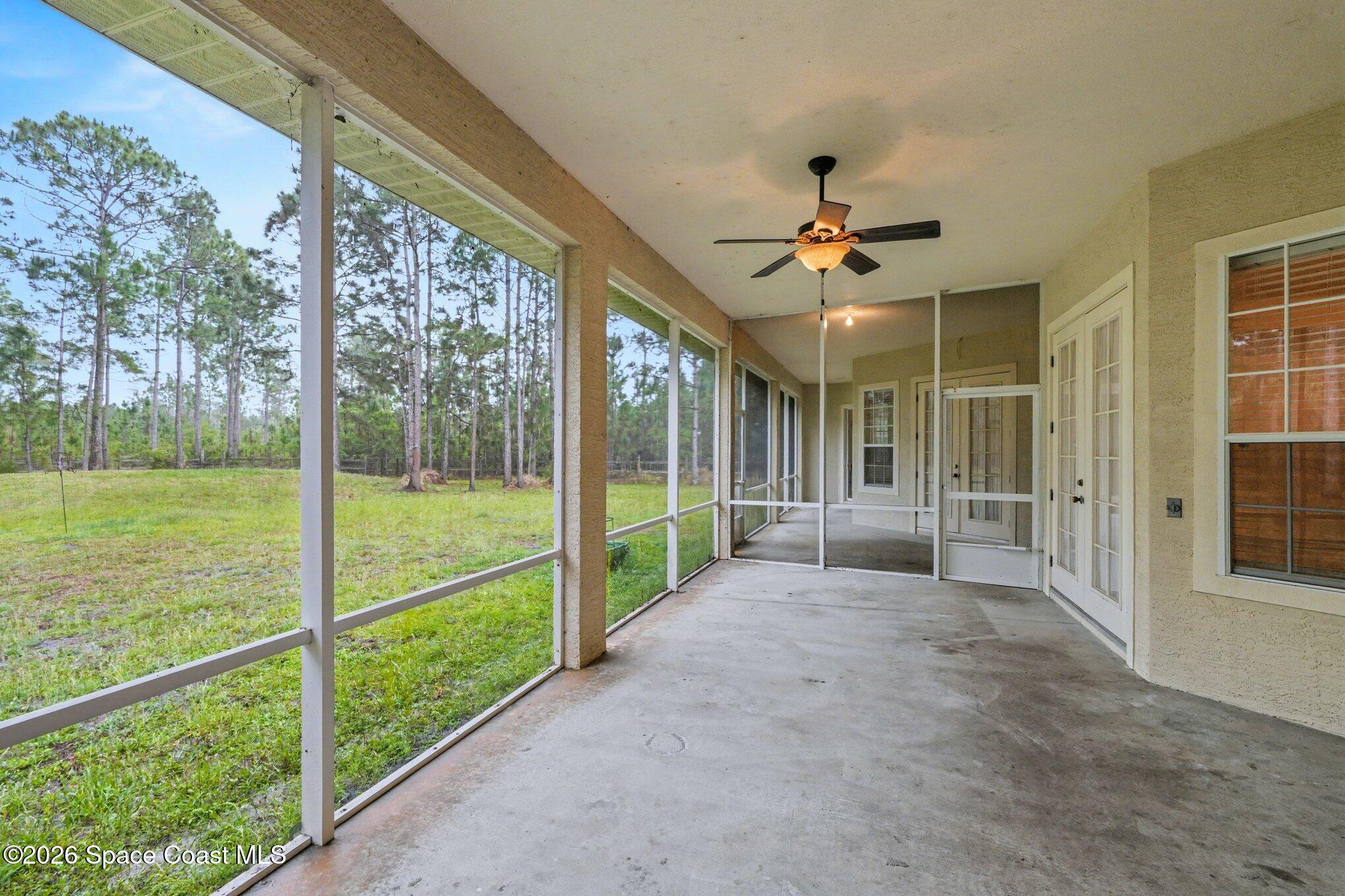 1399 Snapping Turtle Road Mims, FL 32754 - Photo 38 of 51 a view of a room with a big yard and large trees