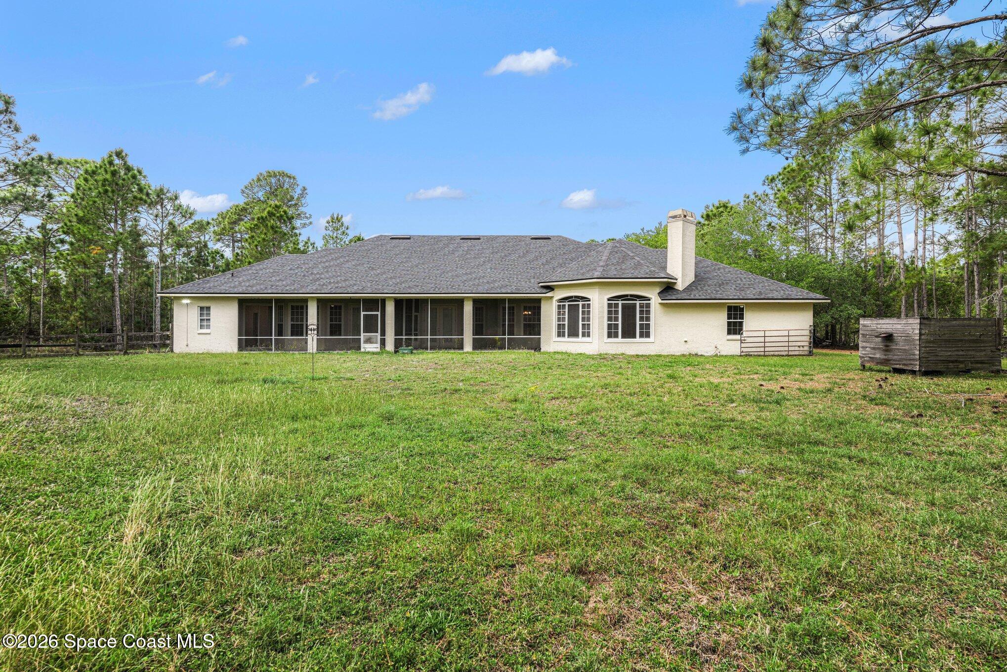 1399 Snapping Turtle Road Mims, FL 32754 - Photo 40 of 51 a front view of a house with a garden