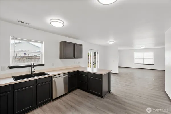 a kitchen with a sink and cabinets