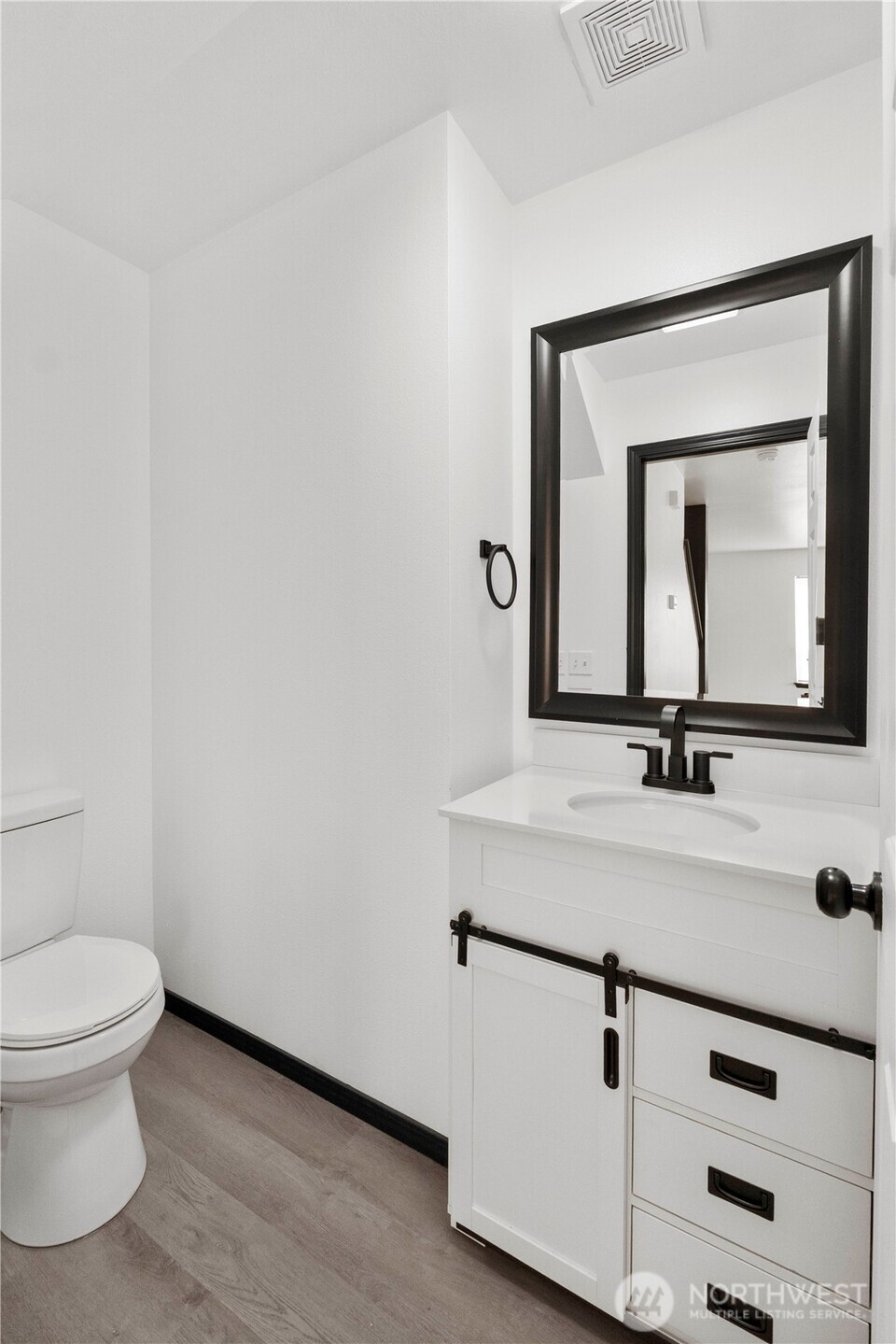 116 Mazza Street Northeast Orting, WA 98360 - Photo 15 of 39 a bathroom with a toilet sink and mirror