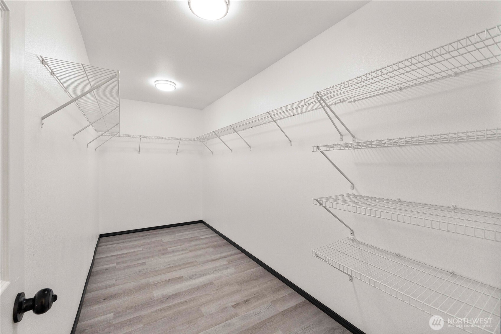 116 Mazza Street Northeast Orting, WA 98360 - Photo 27 of 39 a view of a room with racks on the wall