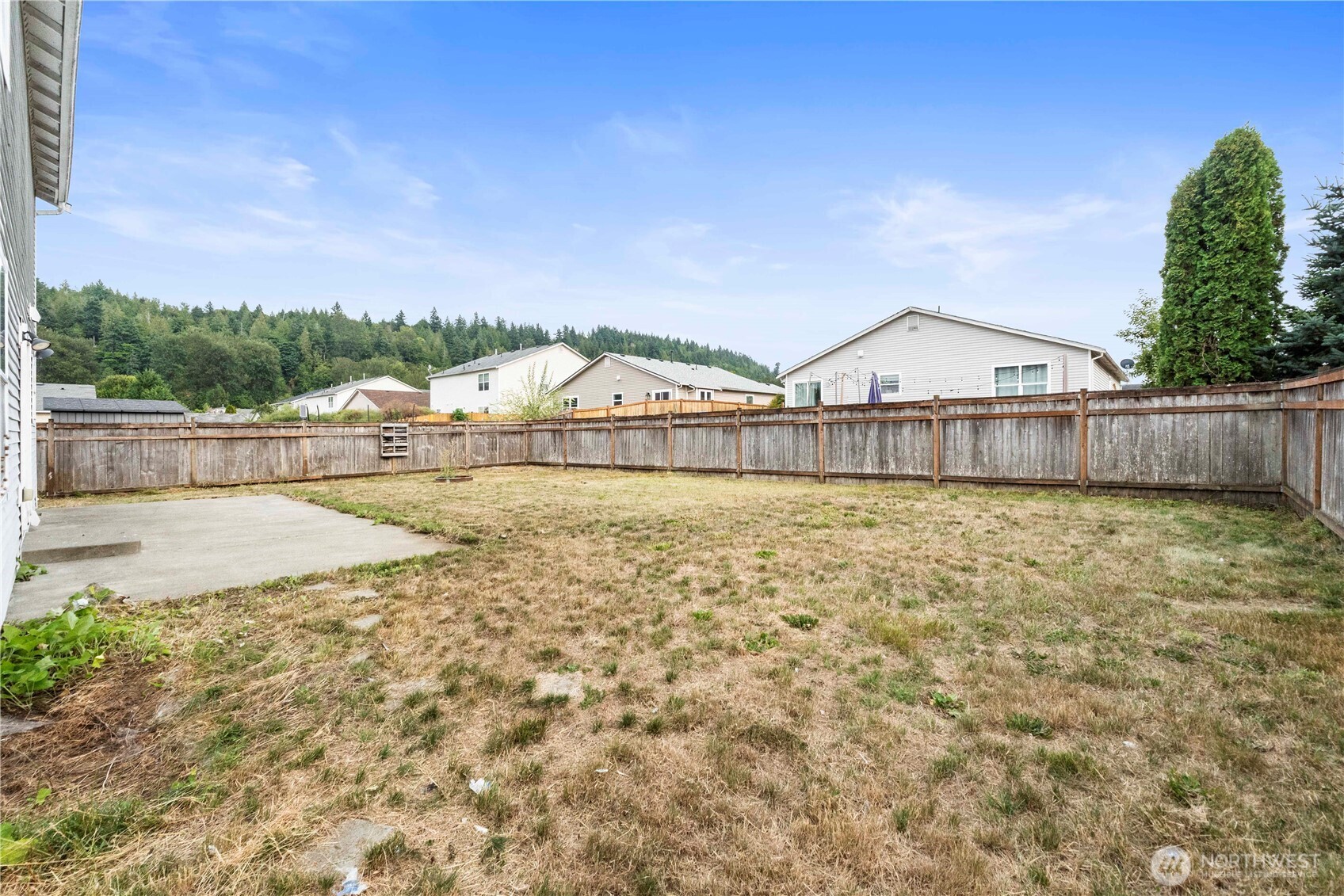116 Mazza Street Northeast Orting, WA 98360 - Photo 32 of 39 a view of a house with a yard
