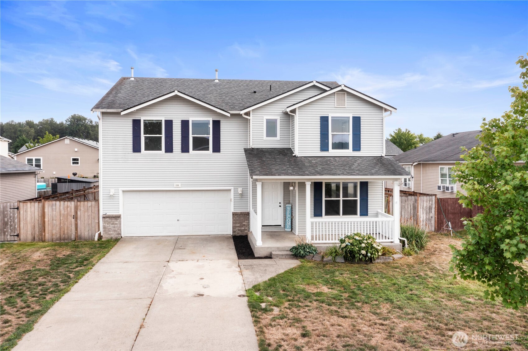 116 Mazza Street Northeast Orting, WA 98360 - Photo 37 of 39 a front view of a house with a yard