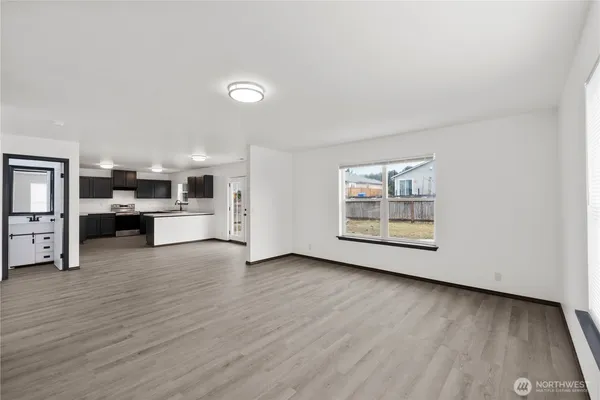 a view of kitchen with furniture and wooden floor