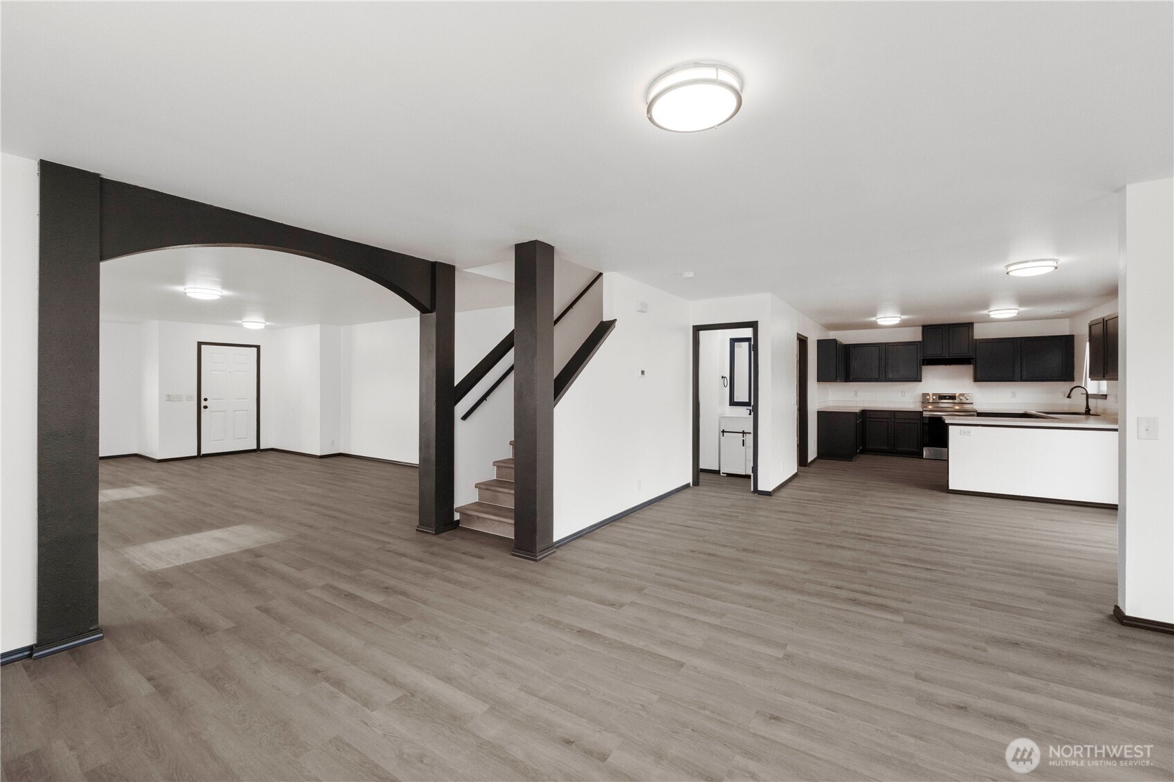 116 Mazza Street Northeast Orting, WA 98360 - Photo 7 of 39 a view of a kitchen with a sink and a refrigerator