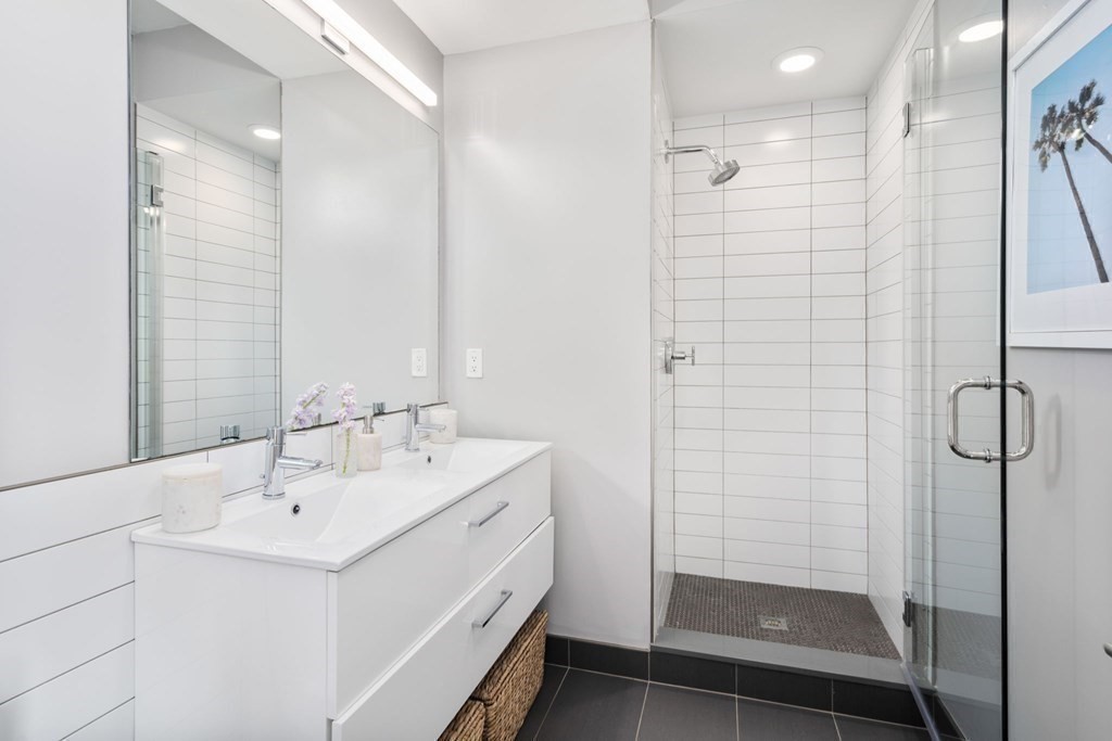7 East Springfield Street, Unit 5B Boston, MA 02118 - Photo 8 of 19 a bathroom with a shower sink and mirror
