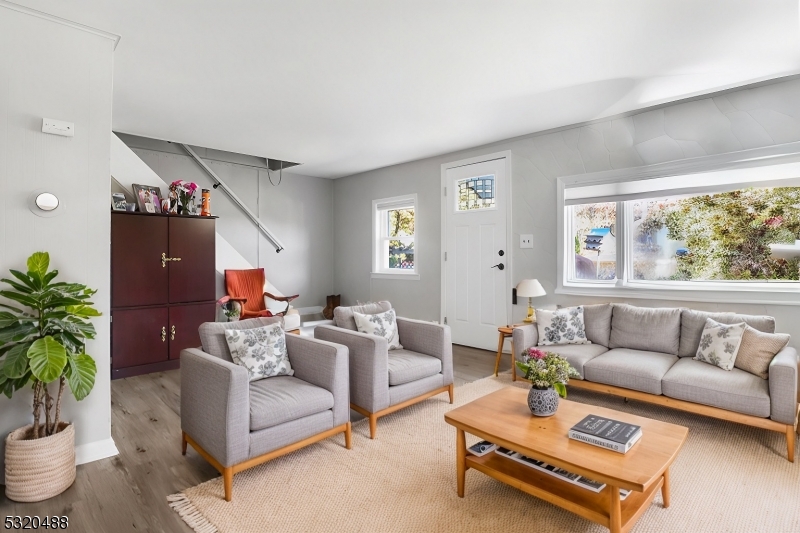 57 Terrace Avenue Butler, NJ 07405 - Photo 1 of 20 a living room with furniture and a large window