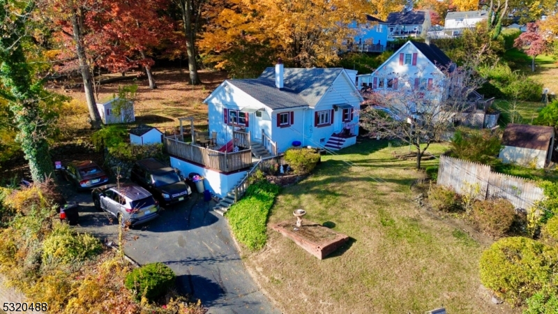 57 Terrace Avenue Butler, NJ 07405 - Photo 14 of 20 a view of houses with outdoor space and parking