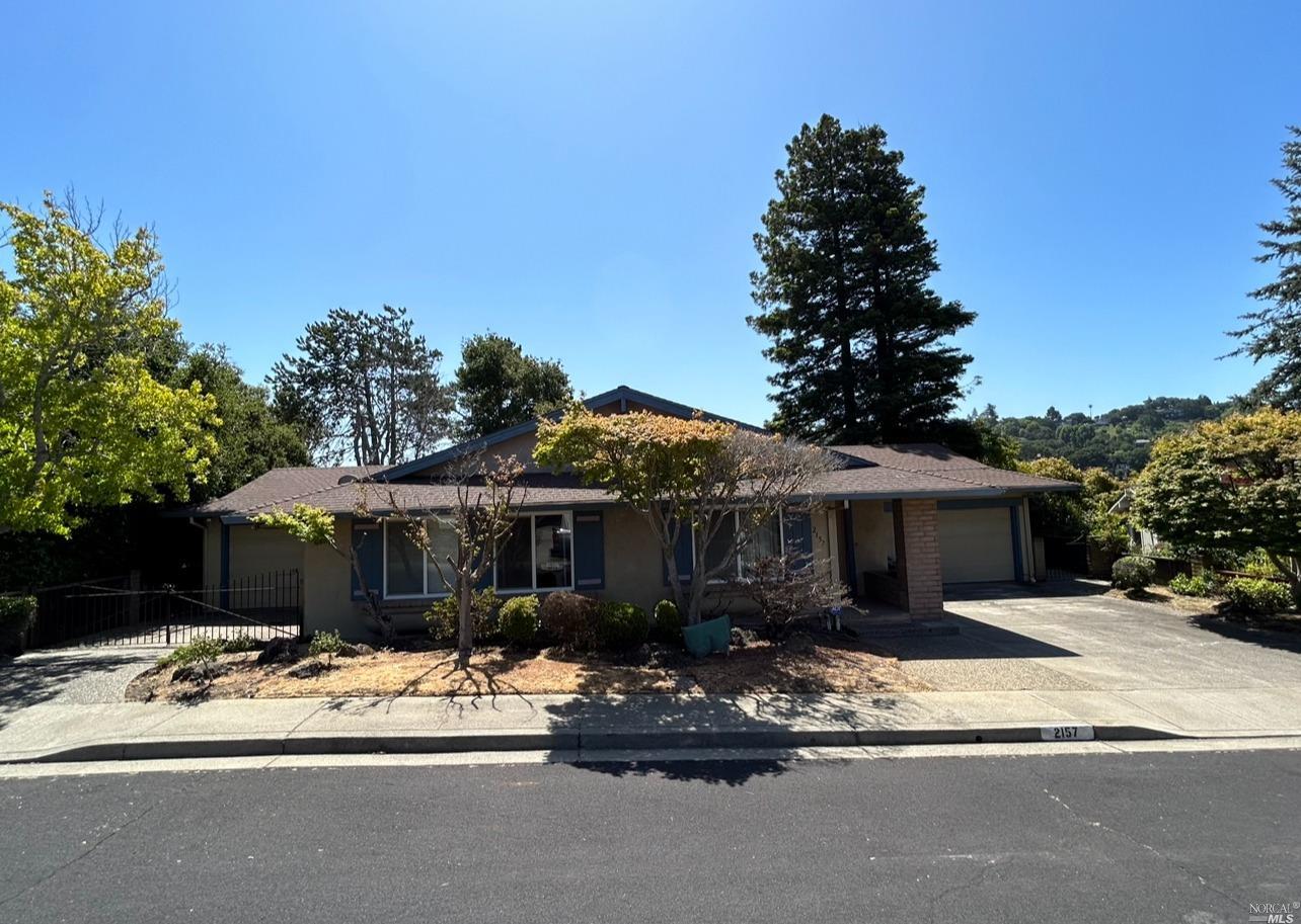 2157 Blue Jay Circle Pinole, CA 94564 - Photo 1 of 1 a front view of a house with a yard