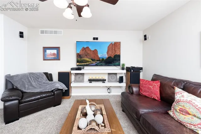 a living room with furniture and a couch