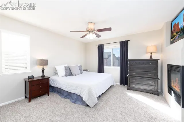 a bedroom with a bed dresser and a window