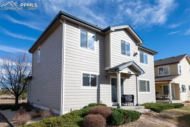a bathroom with a sink and windows