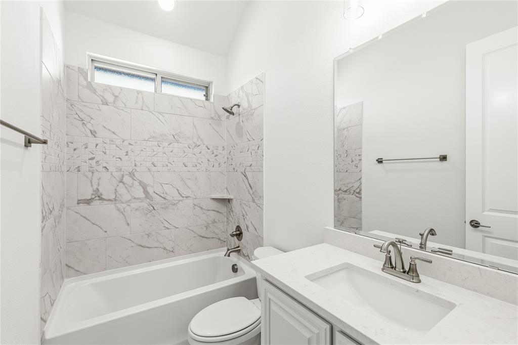 1145 Hitching Post Way Oak Point, TX 75068 - Photo 15 of 39 a bathroom with a sink toilet and shower