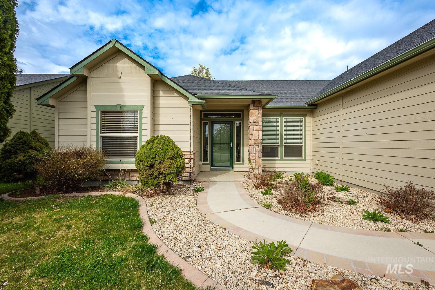 4227 North Rhodes Avenue Meridian, ID 83646 - Photo 3 of 42 Entrance to property featuring a shingled roof and stone siding