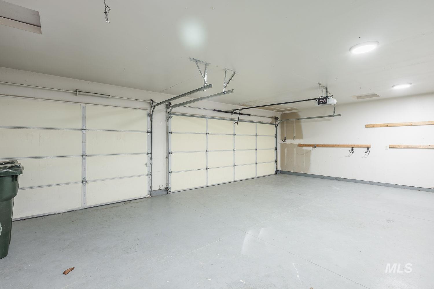 4227 North Rhodes Avenue Meridian, ID 83646 - Photo 38 of 42 Garage featuring a garage door opener
