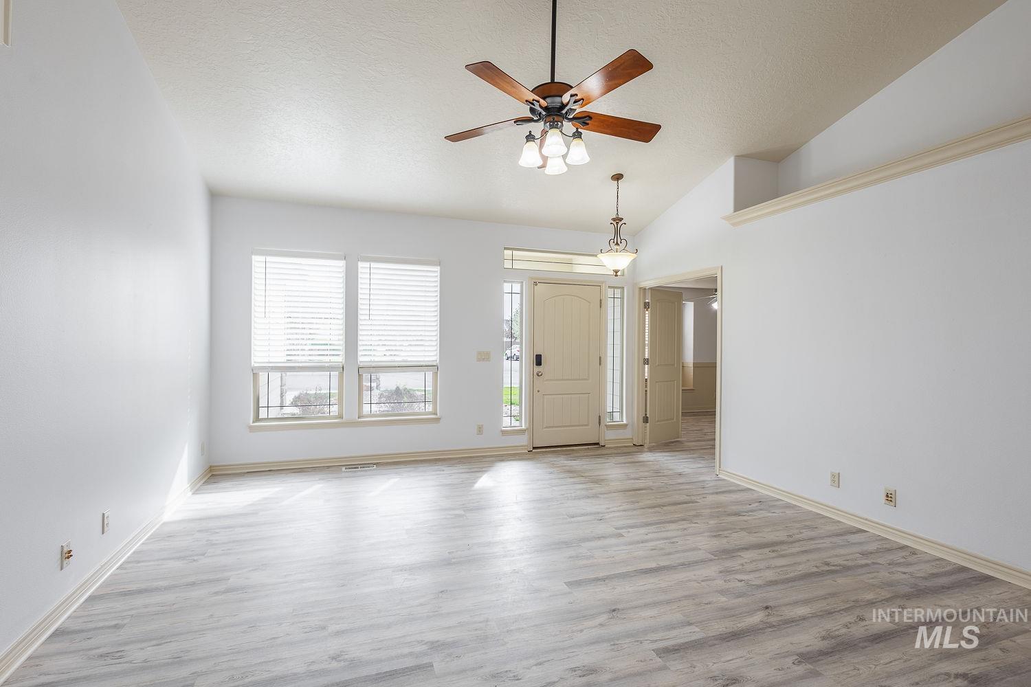 4227 North Rhodes Avenue Meridian, ID 83646 - Photo 5 of 42 Entrance foyer with a ceiling fan and light wood-type flooring