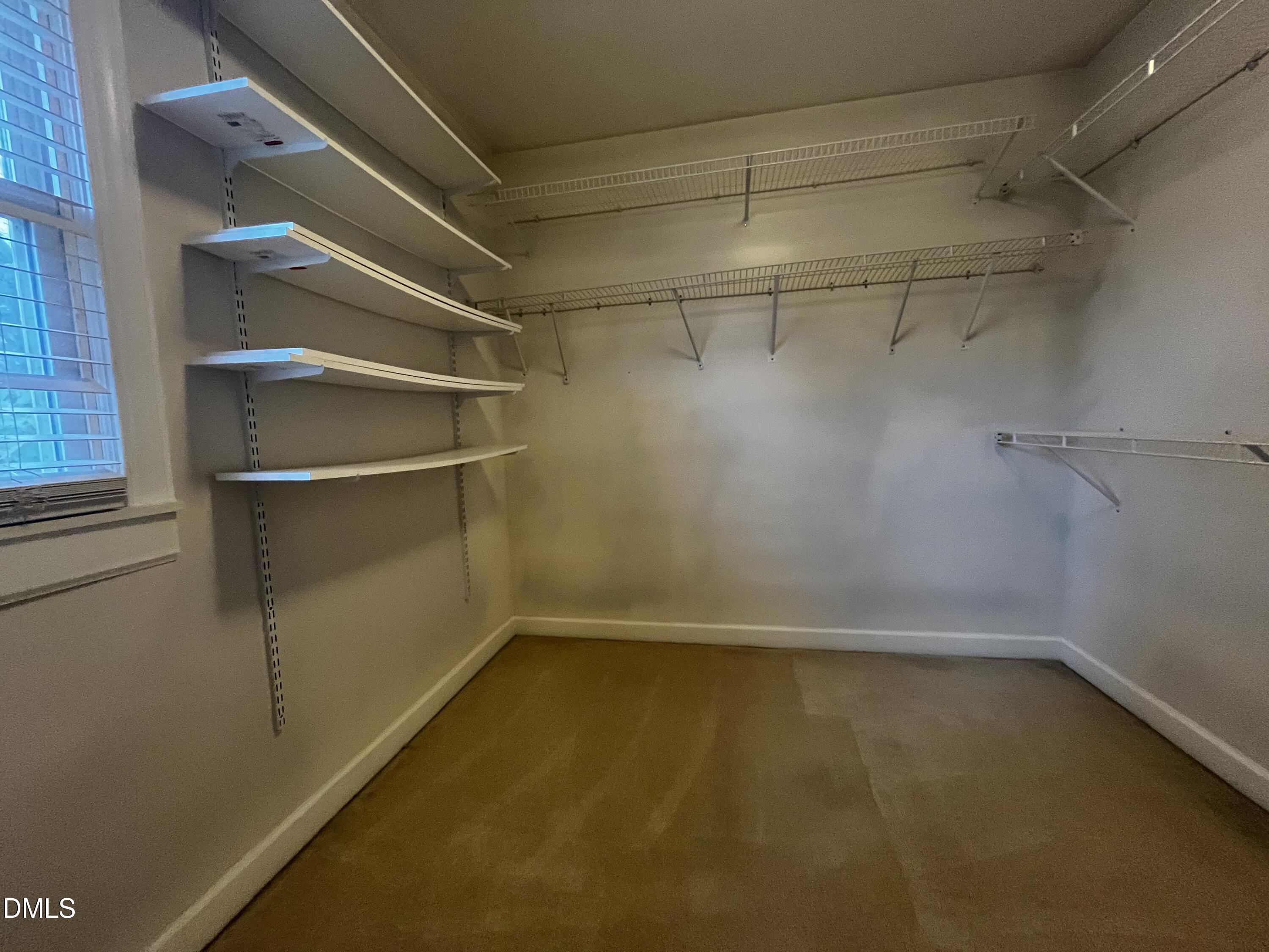 712 Hadley Road Raleigh, NC 27610 - Photo 7 of 11 a view of a room with racks on the wall