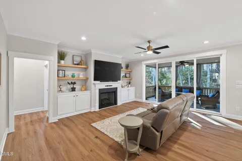 a living room with furniture and kitchen view