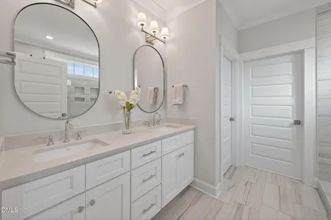 a view of a hallway with wooden floor and stairs