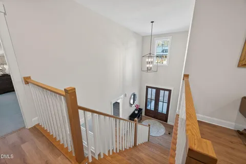 a bathroom with a granite countertop toilet sink and mirror
