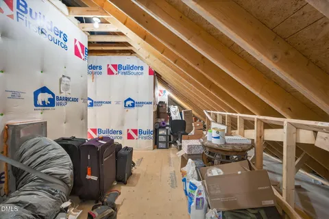 a view of a house with wooden deck and backyard