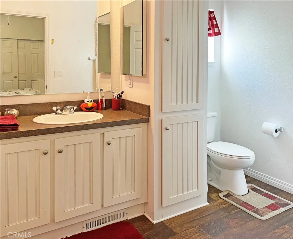 449 West Tefft Street, Unit 39 Nipomo, CA 93444 - Photo 11 of 17 a bathroom with a sink a toilet and a mirror