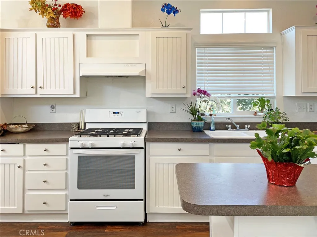 449 West Tefft Street, Unit 39 Nipomo, CA 93444 - Photo 3 of 17 a kitchen with a stove and white cabinets