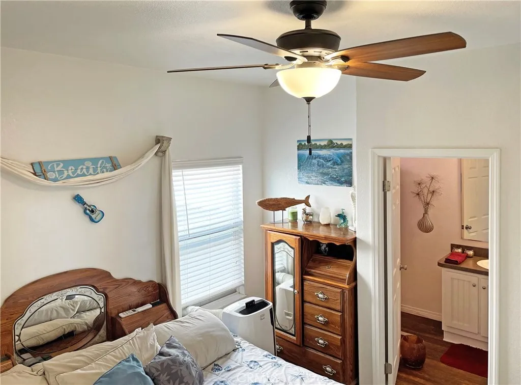 449 West Tefft Street, Unit 39 Nipomo, CA 93444 - Photo 4 of 17 a bedroom with furniture and a chandelier