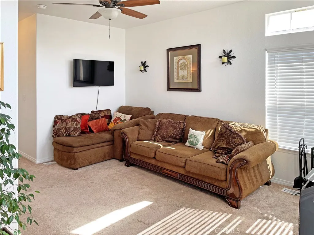 449 West Tefft Street, Unit 39 Nipomo, CA 93444 - Photo 8 of 17 a living room with furniture and a flat screen tv