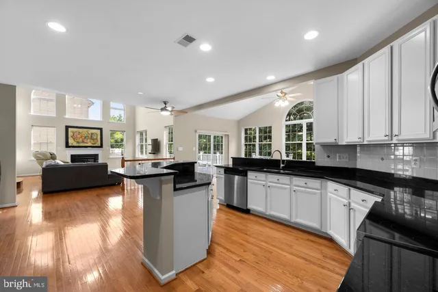 a kitchen with sink and cabinets