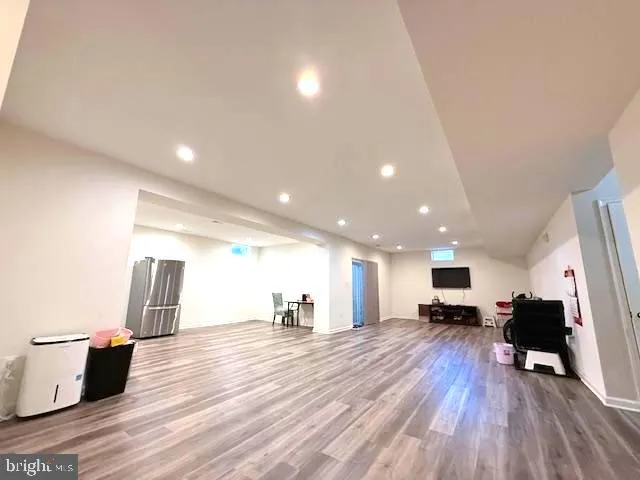 a view of kitchen with refrigerator microwave and stove
