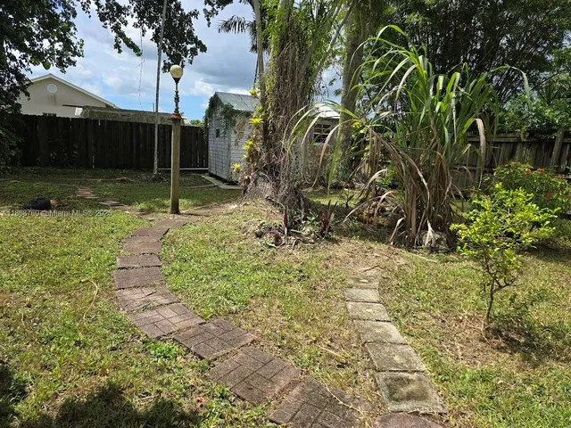a backyard of a house with lots of green space
