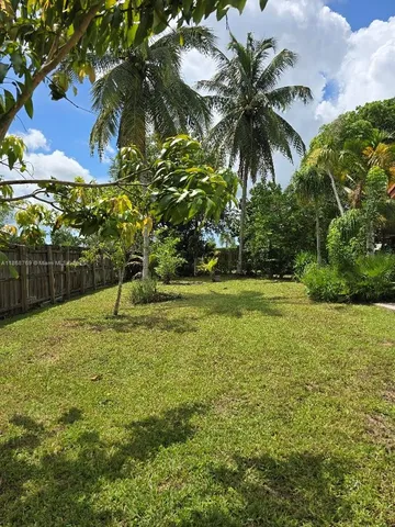a view of a yard and entertaining space