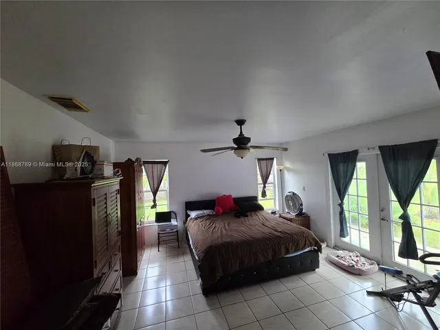 a bedroom with a bed and a cabinets