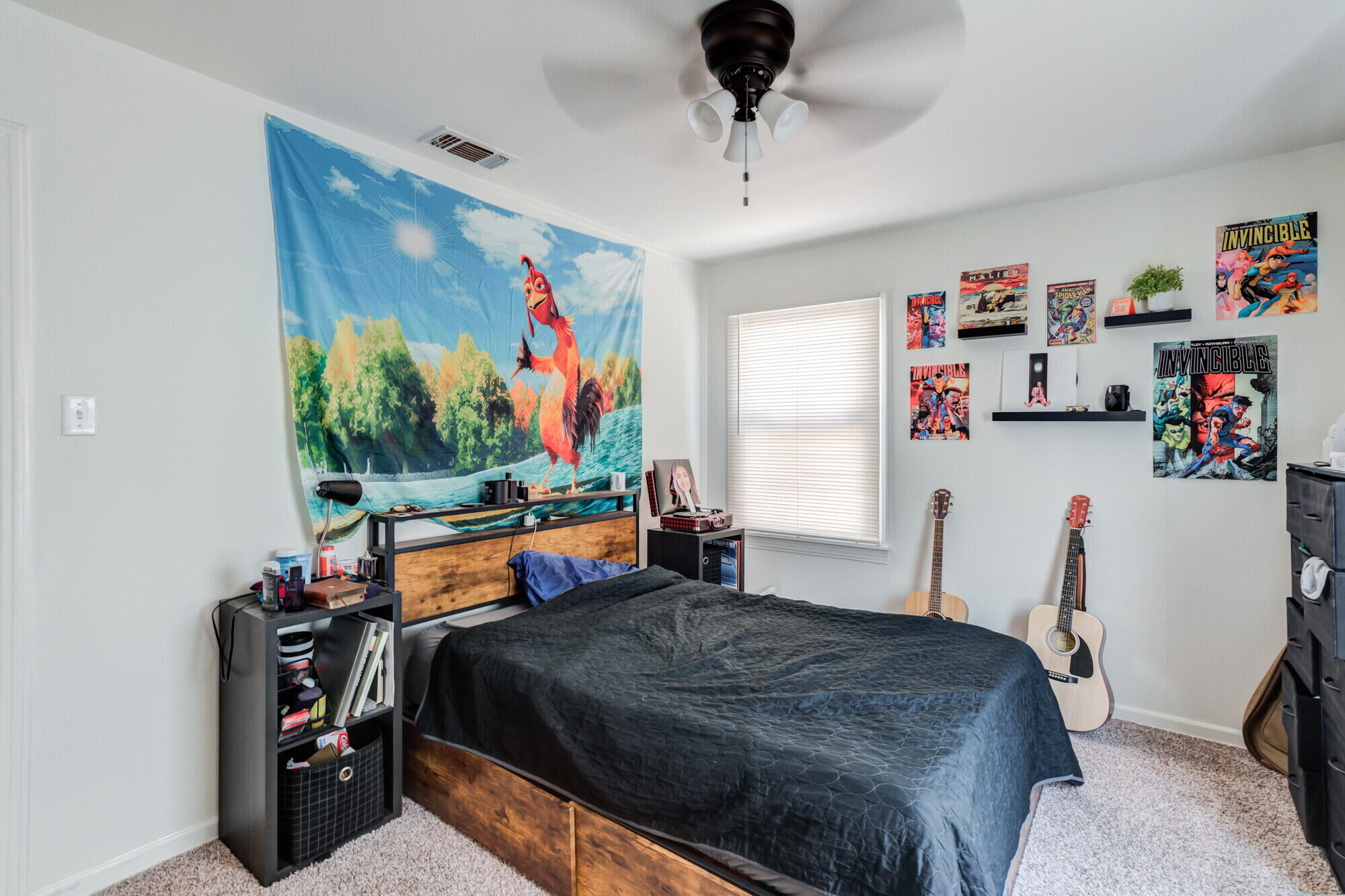 3314 31st Street Lubbock, TX 79410 - Photo 18 of 29 a bedroom with a bed and a bookshelf