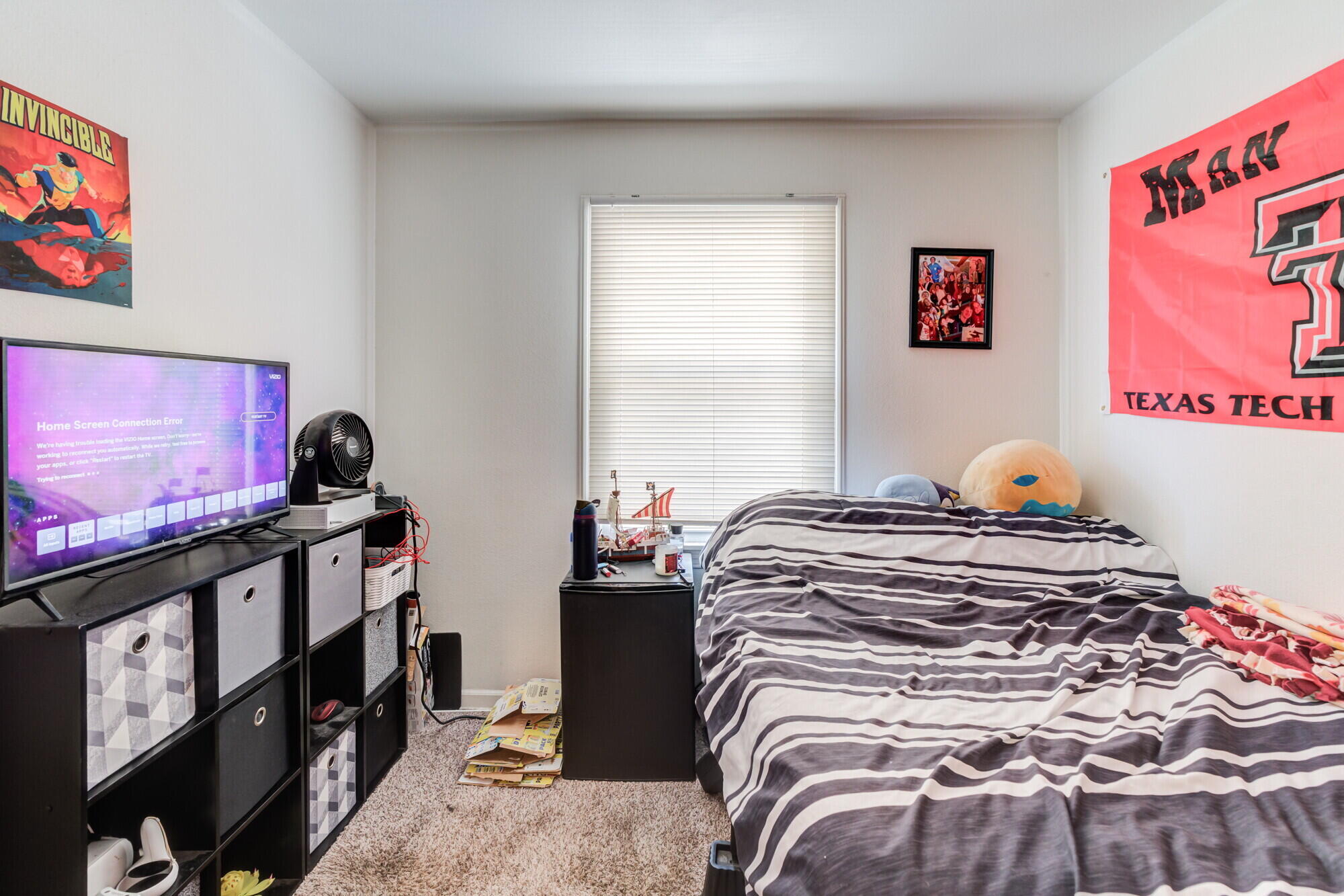 3314 31st Street Lubbock, TX 79410 - Photo 20 of 29 a bedroom with a bed and a window