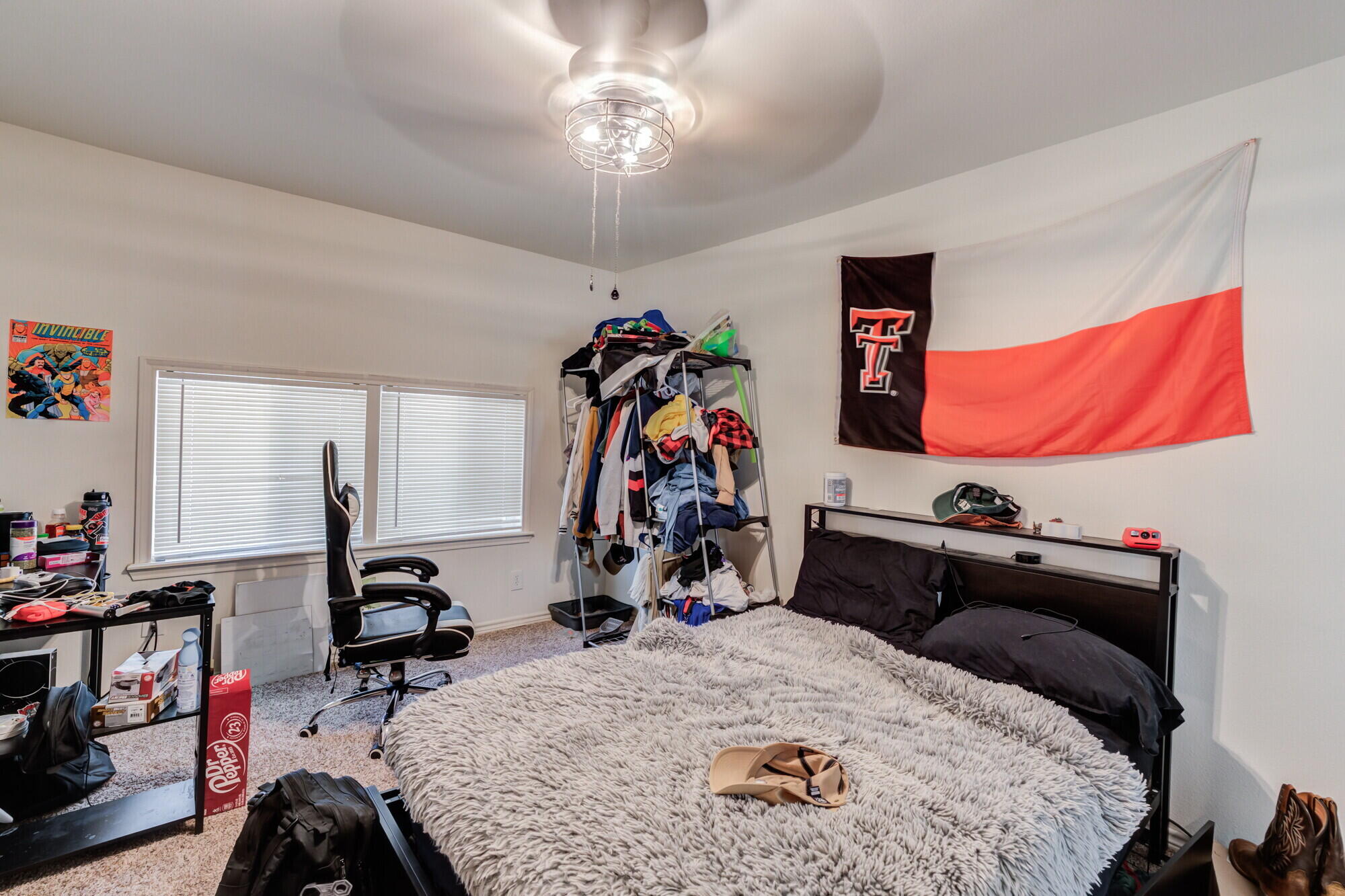 3314 31st Street Lubbock, TX 79410 - Photo 21 of 29 a bed room with a bed and a gym