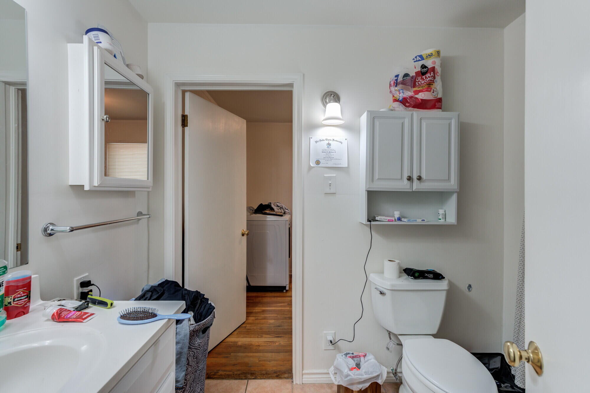 3314 31st Street Lubbock, TX 79410 - Photo 23 of 29 a bathroom with a sink vanity mirror and toilet