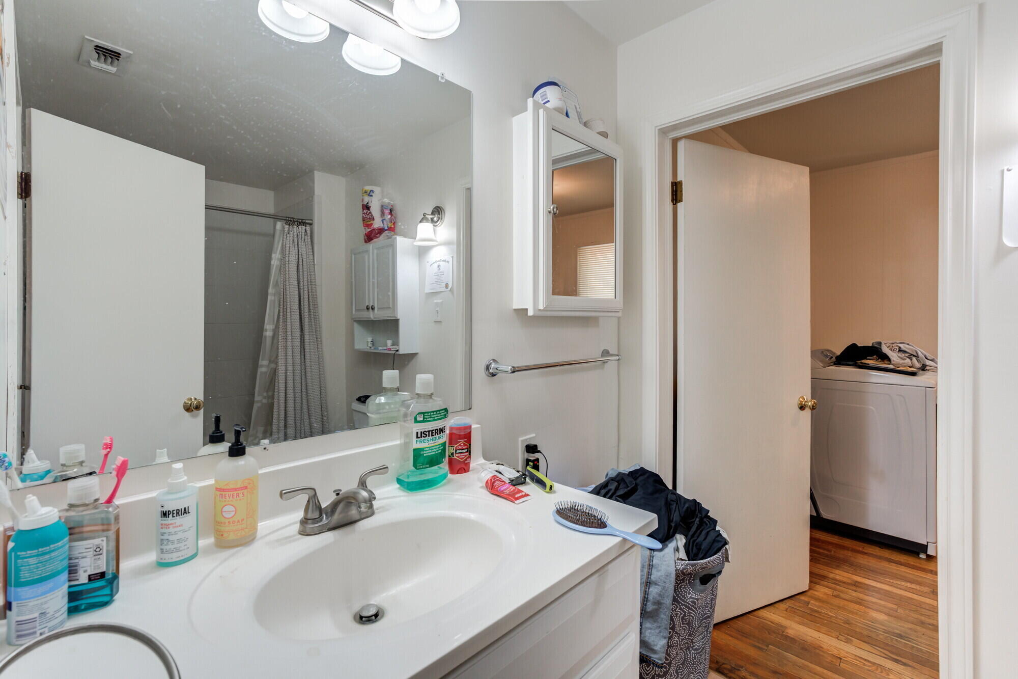 3314 31st Street Lubbock, TX 79410 - Photo 24 of 29 a bathroom with a sink and a mirror