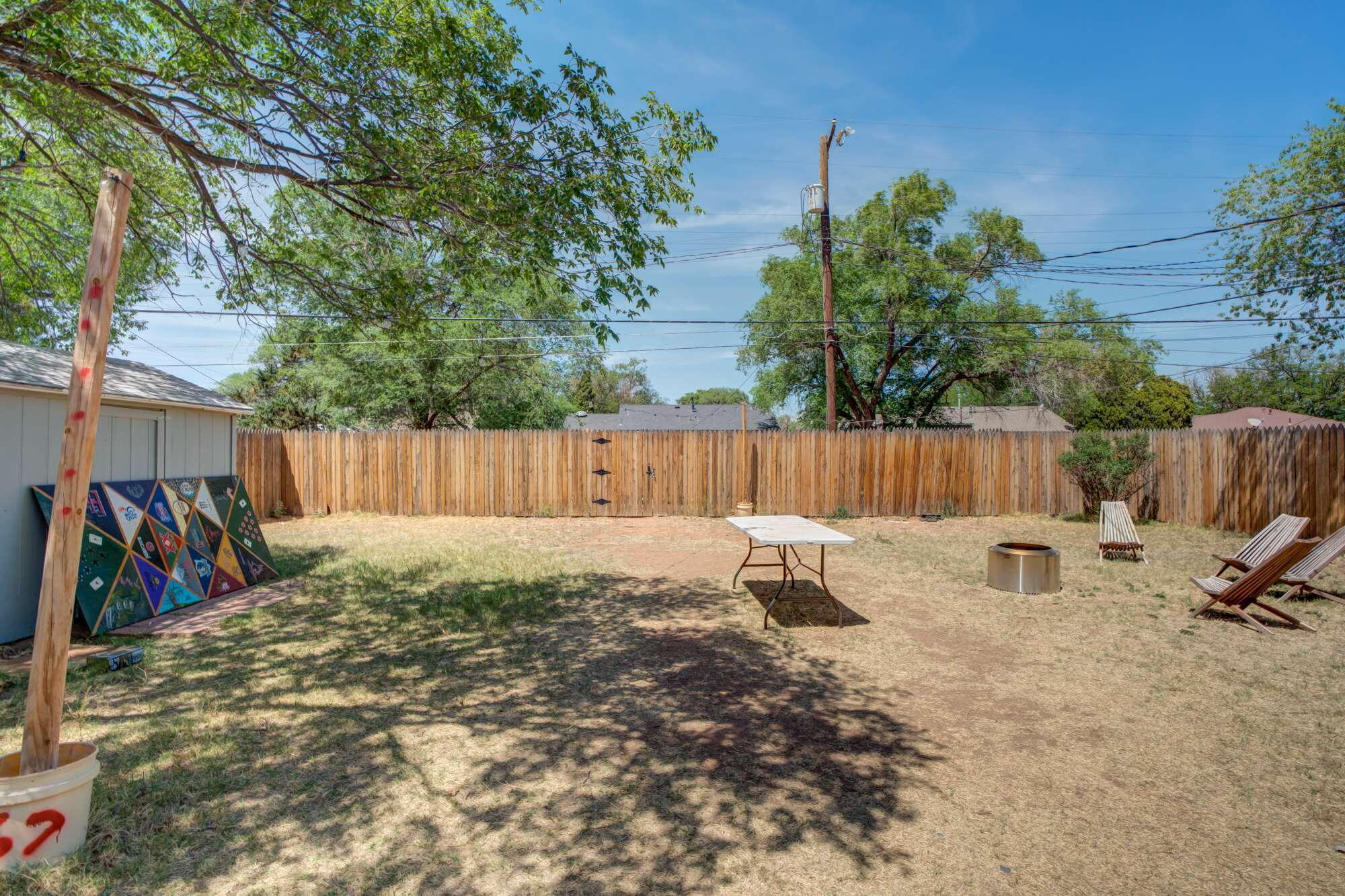 3314 31st Street Lubbock, TX 79410 - Photo 25 of 29 outdoor space with wooden fence and a bench