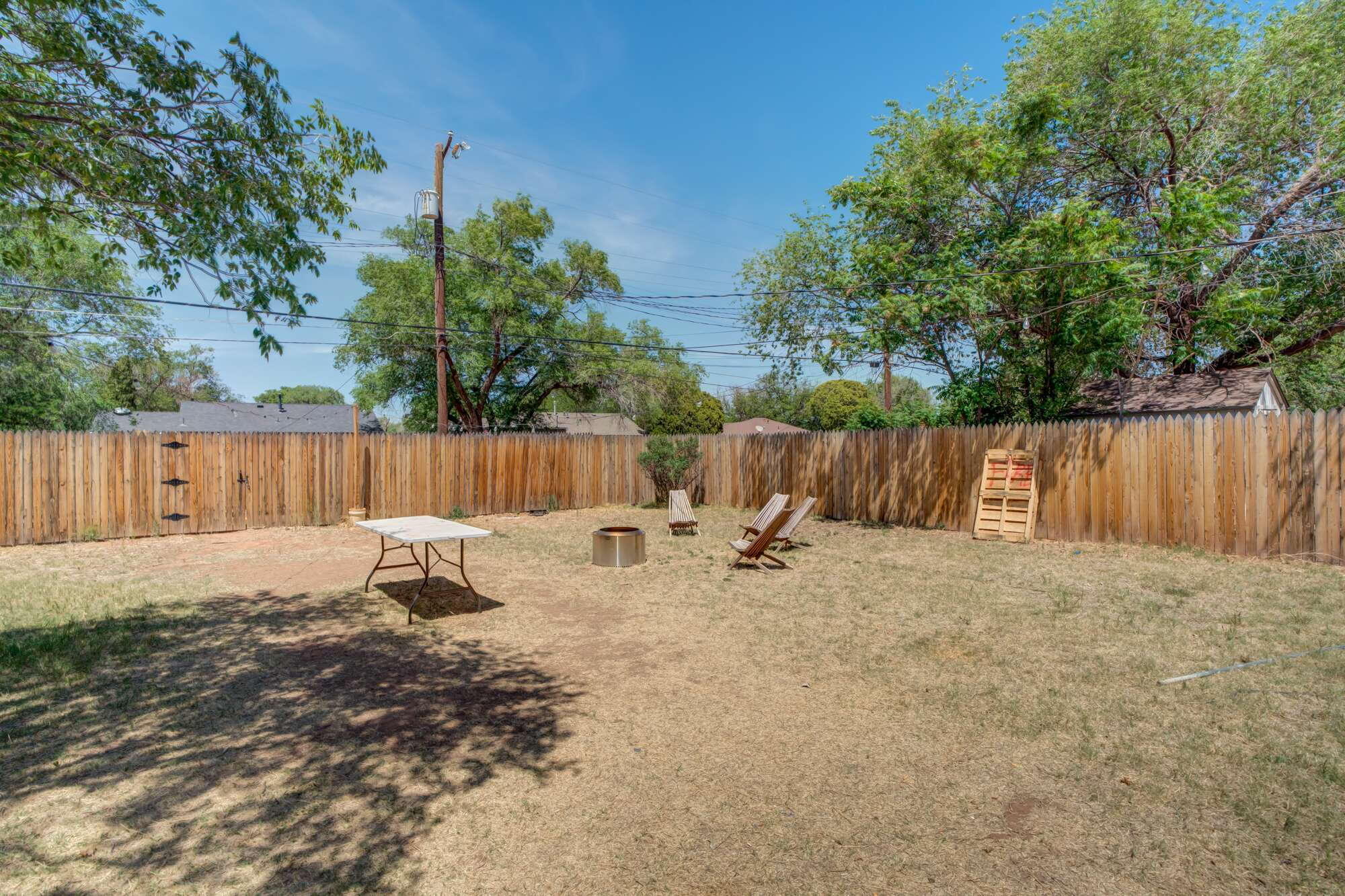3314 31st Street Lubbock, TX 79410 - Photo 26 of 29 a backyard of a house with table and chairs