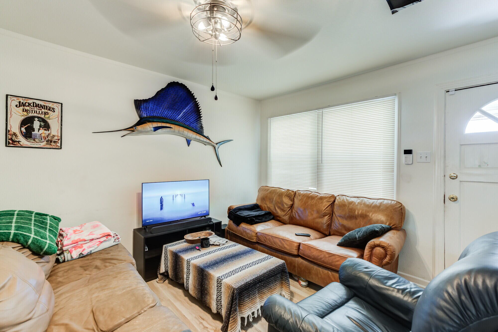 3314 31st Street Lubbock, TX 79410 - Photo 6 of 29 a living room with furniture a couch and a chandelier