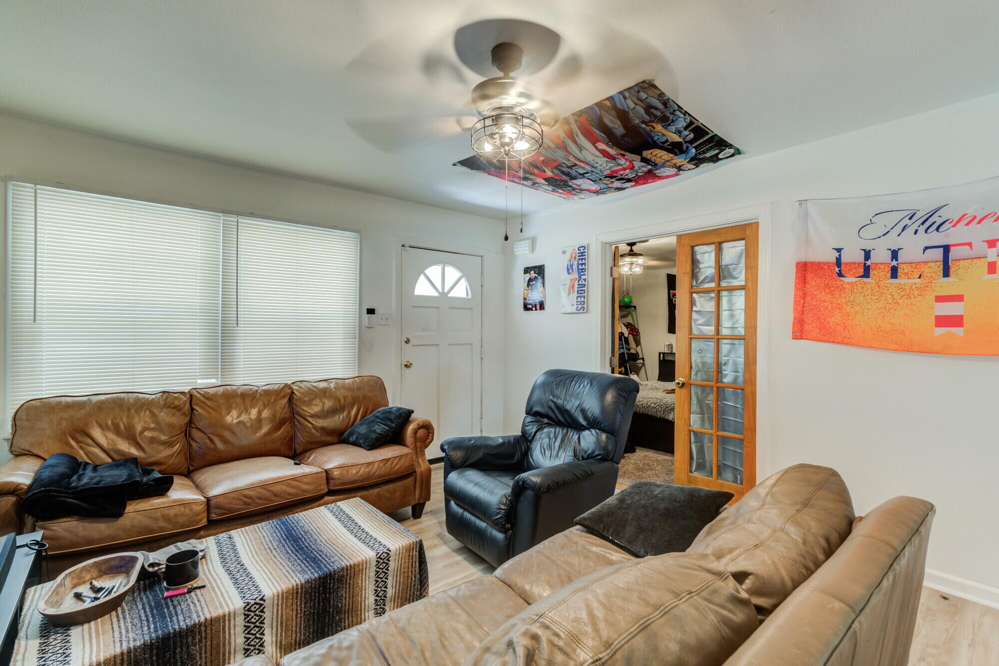 3314 31st Street Lubbock, TX 79410 - Photo 8 of 29 a living room with furniture a couch and chandelier