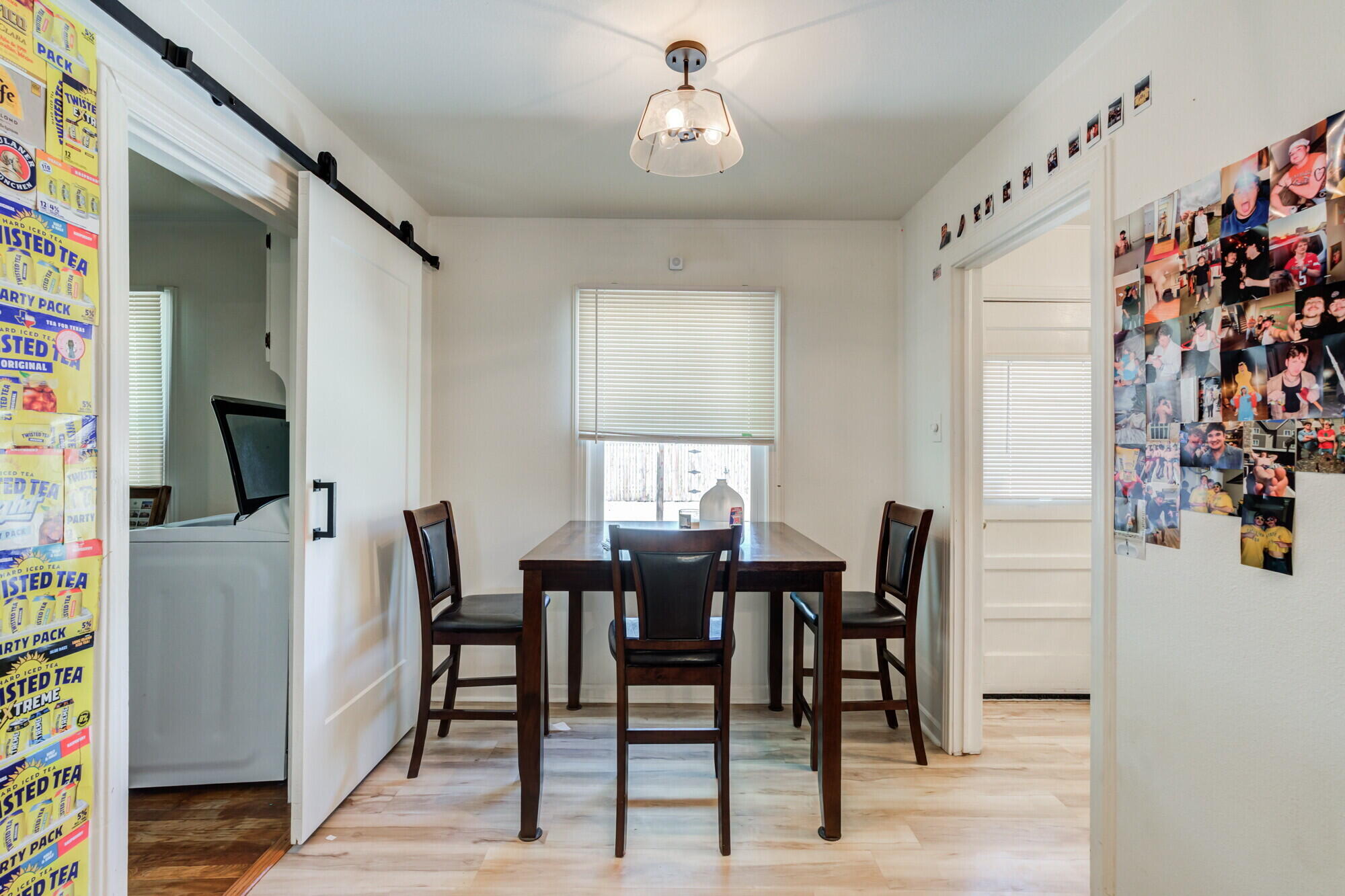 3314 31st Street Lubbock, TX 79410 - Photo 9 of 29 a view of a dining room with furniture and a chandelier
