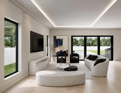 a living room with furniture large windows and flat screen tv