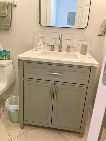 a bathroom with a sink and a toilet