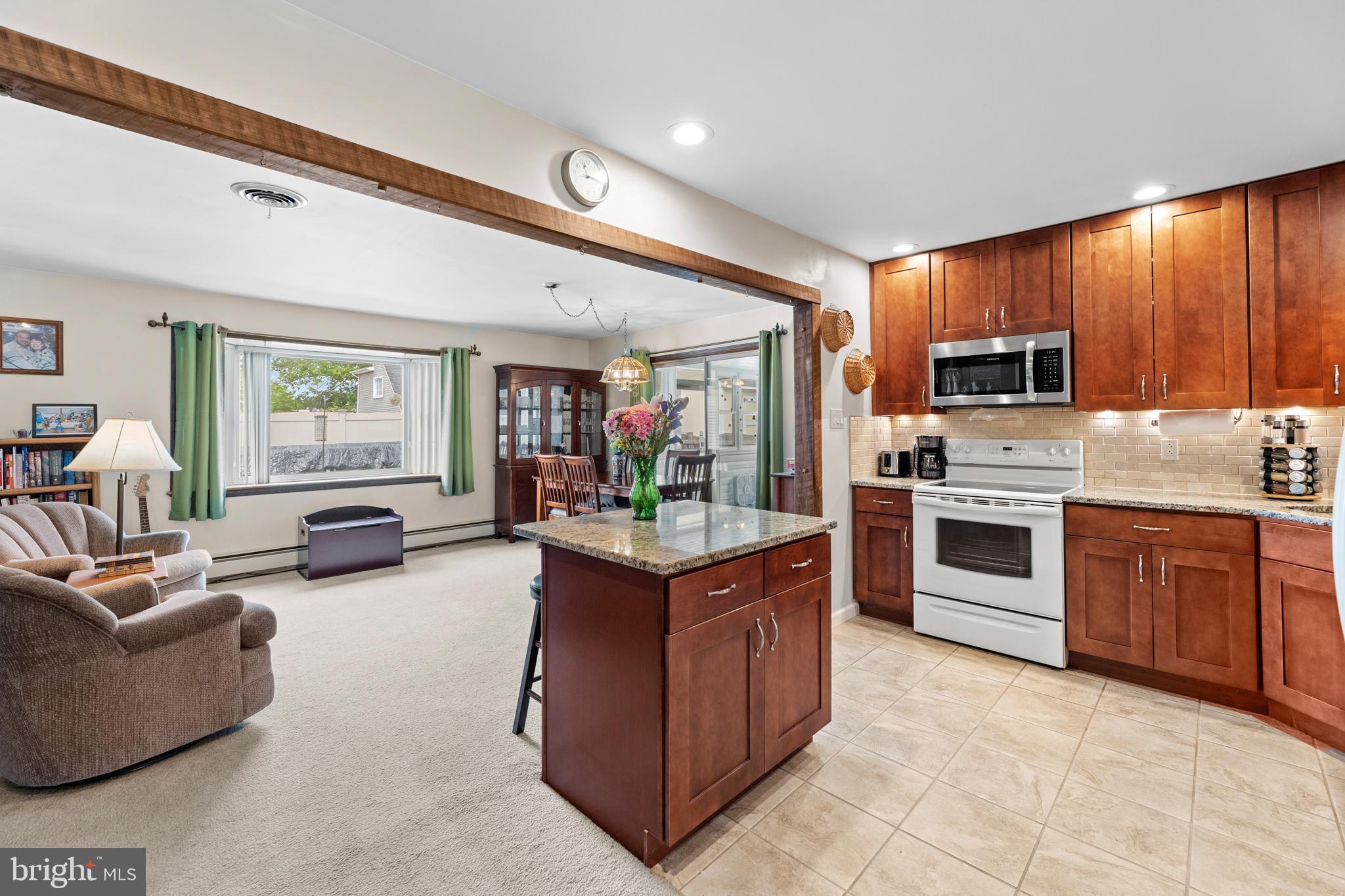 15 Iris Road Levittown, PA 19057 - Photo 7 of 35 Open plan kitchen, family room, dining area
