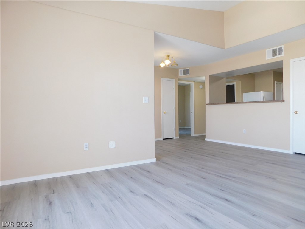 7255 West Sunset Road, Unit 2029 Las Vegas, NV 89113 - Photo 4 of 21 This versatile living space features light-toned plank flooring and ample wall space for personalized decor.